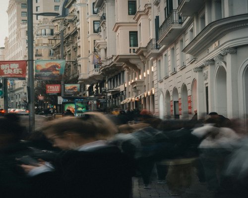 Busy city street with people walking during rush hour
